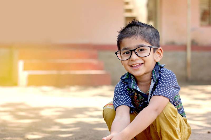 A child wearing a pair of glasses.