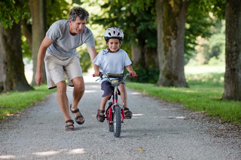 A child riding a bicycle.