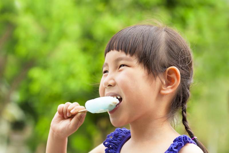 A child eating an ice cream.