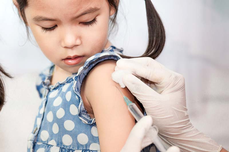 Vaccinating a child.